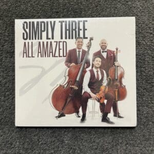 A cd cover with three men playing musical instruments.