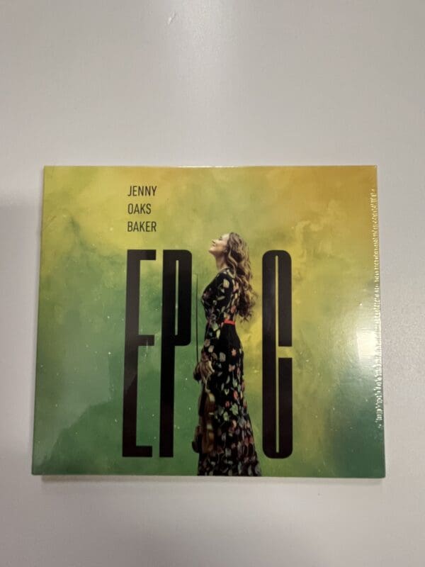 A cd cover with the word " epic " written in front of a woman.