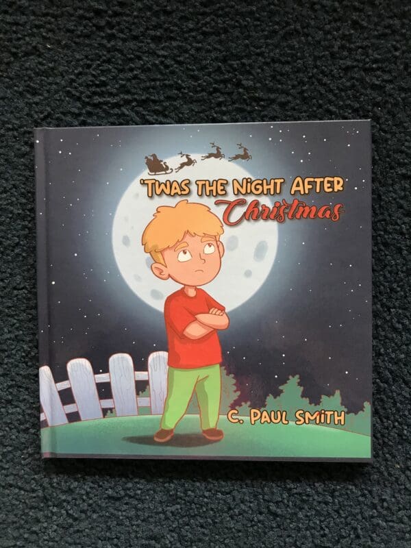 A book cover with a boy standing in front of the moon.