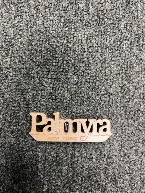 A wooden sign that says palmyra.