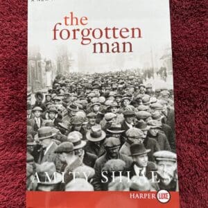 A book cover with the title of the forgotten man.