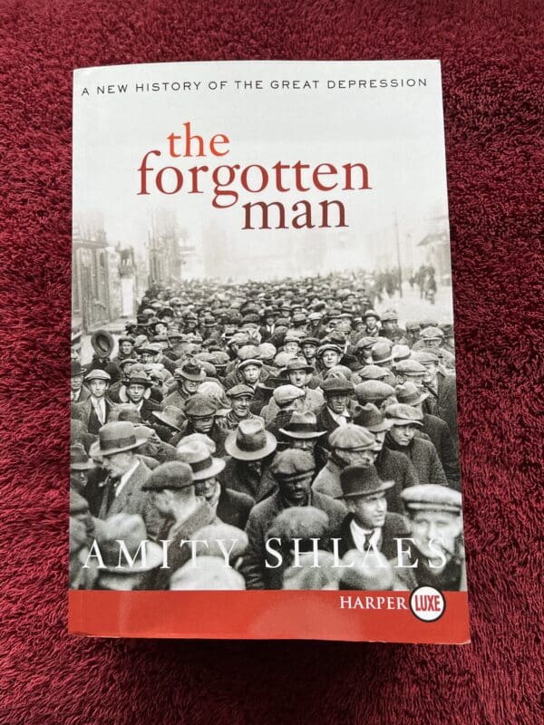 A book cover with the title of the forgotten man.