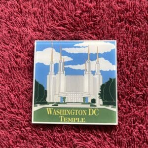 A washington dc temple magnet on top of a rug.