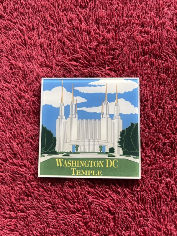 A washington dc temple magnet on top of a rug.