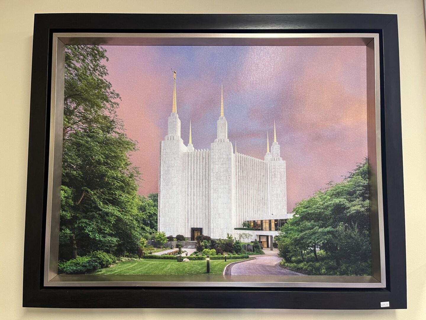 A painting of the mormon temple in the distance.