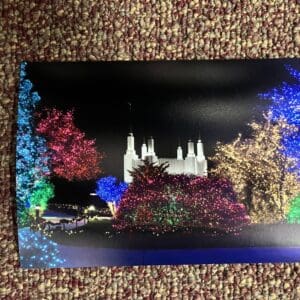 Christmas lights illuminate temple at night.