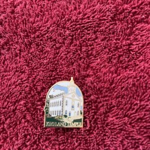 Kirtland Temple pin on red towel.