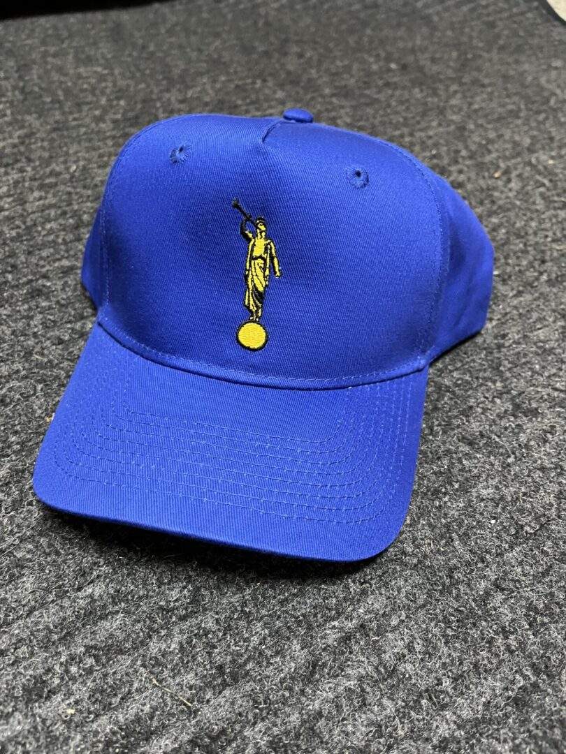 Blue baseball cap with angel design.